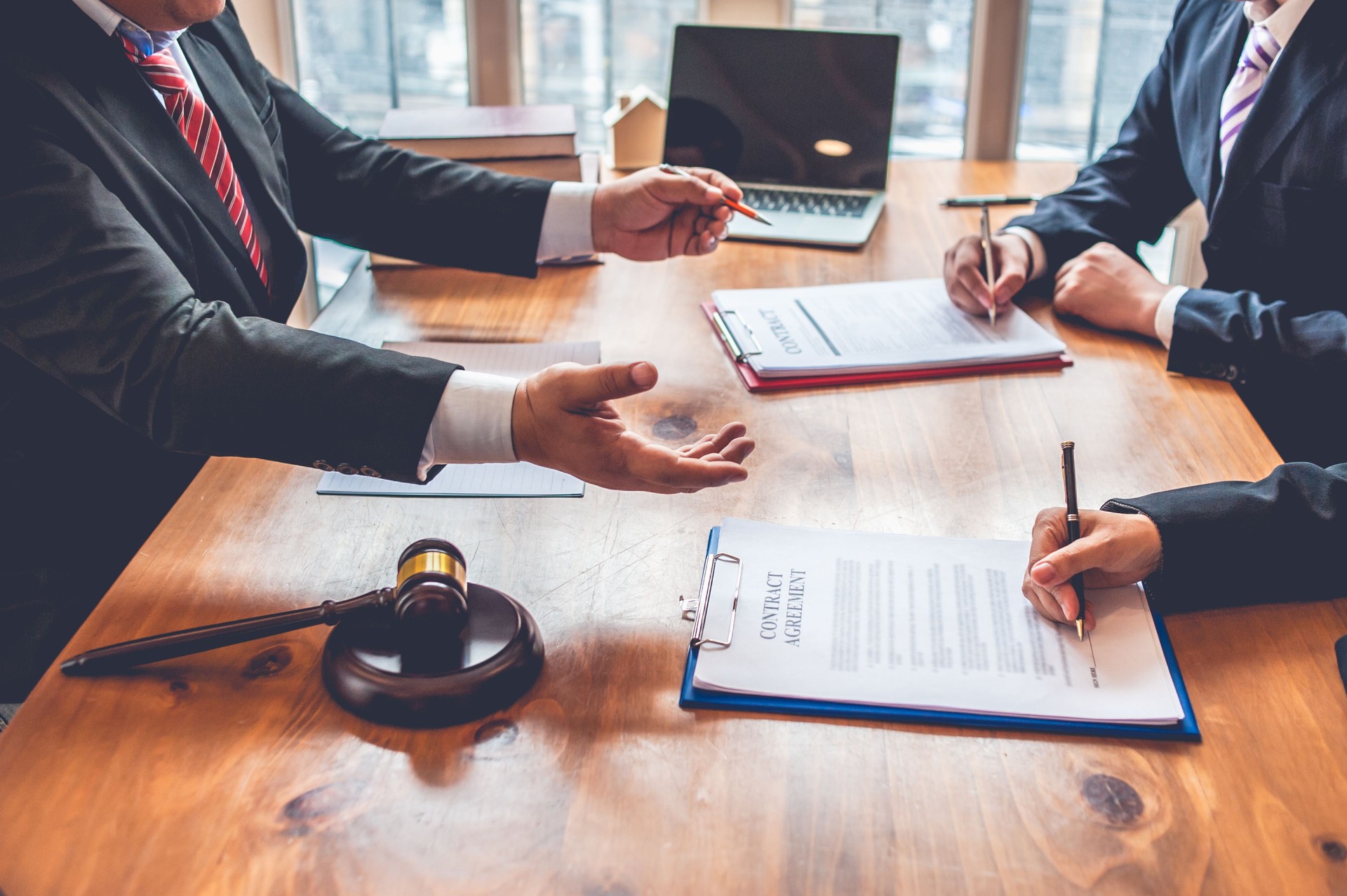 business people and lawyers discussing contract papers.Legal planning. Concepts of law, advice, legal services